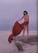 Nude outside Yumiko Itaya holds red cape