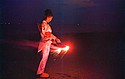 Chiasa Aonuma in a yukata playing with a sparkler