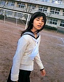 Schoolgirl uniformed Minori Aoi walks on field