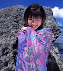 Smiling Minori Aoi wraps a towel around herself