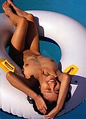 Smiling Momoko Nishida lies nude in pool raft