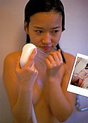 Noriyo Ezawa in the shower covering her tiny Japanese breasts