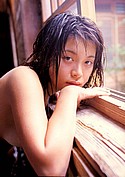 Naked and soaked Rika Inoue leans over wooden window frame