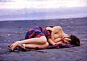 Rika Inoue lies nearly nude on desolate and isolated beach