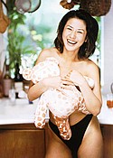 Laughing topless Yuu Kinoshita covers breasts with fluffy toy
